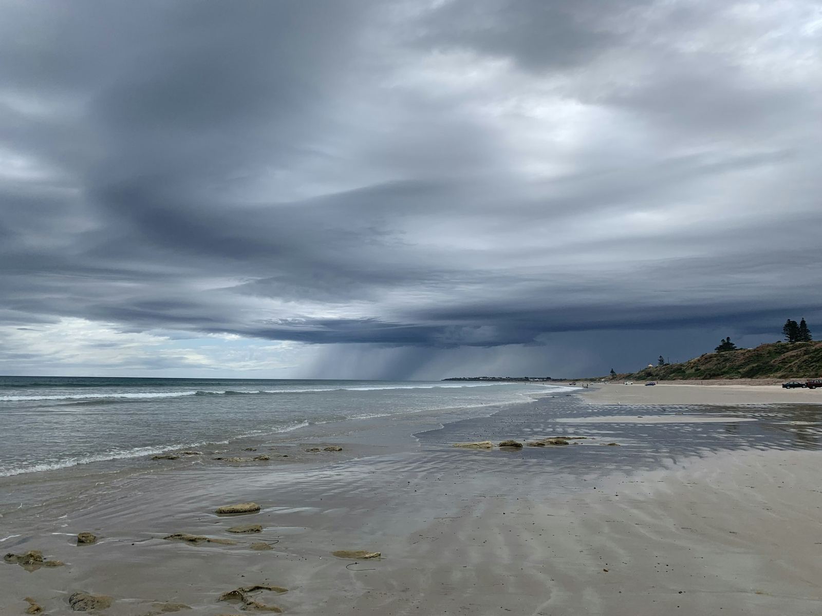 Wet sand along a shoreline